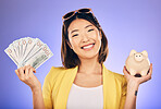 Piggy bank, portrait and woman with money savings, financial investment and profit, increase or budget success. Asian person with banking notes, cash and safe or container on studio purple background