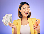 Cash, phone and happy woman for winning finance, online savings or fintech profit and cashback. Success, lottery and winner or asian person on mobile, money fan or banking on studio purple background
