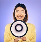 Woman, megaphone and happy portrait in studio for announcement, voice or broadcast. Face of a young asian female speaker with a loudspeaker for communication, message or speech on purple background