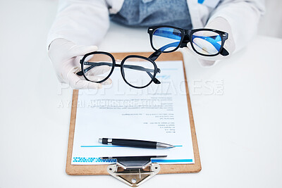 Buy stock photo Hands, vision and glasses test with consulting and healthcare contract in consultation with support. Hospital, lens care and paperwork with doctor and ophthalmologist holding eyewear in clinic