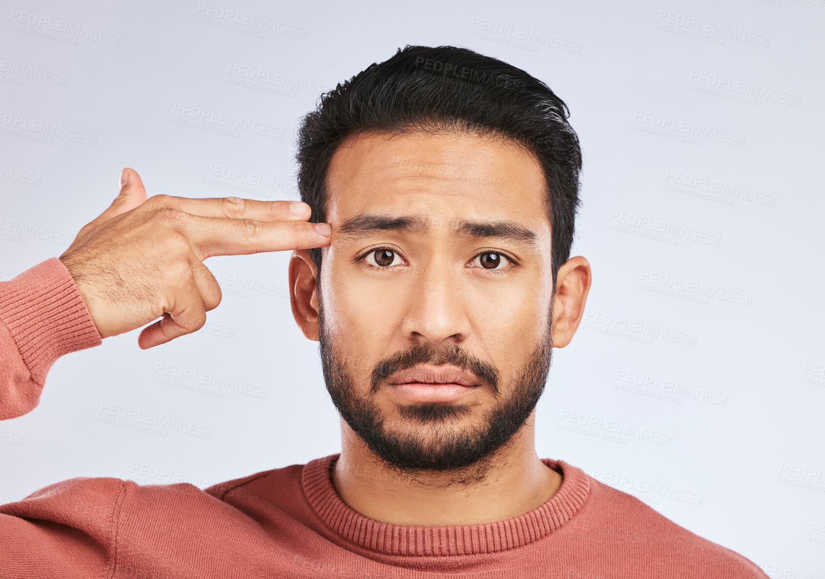Buy stock photo Depression, portrait and sad asian man with hand gun in studio for suicide, trauma or ptsd fail on grey background. Stress, face and guy with weapon emoji for death, anxiety or mental health crisis