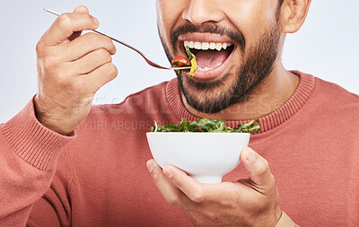 Buy stock photo Health studio, man and mouth eating salad, vegetables or green food product for weight loss, healthy lifestyle or nutrition. Closeup nutritionist, lettuce bowl and hungry person on white background

