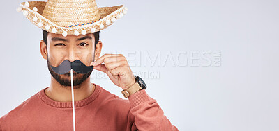 Buy stock photo Photo booth mockup, sombrero and portrait of man with mustache for comic, humor and funny joke. Costume, Mexican party accessory and silly face of male person on gray background with hat for comedy