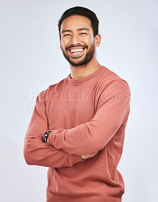Buy stock photo Portrait, happy or Asian man laughing with arms crossed or smile in studio in casual fashion or clothes. Relax, confidence or handsome male person smiling on white background with pride, humor or joy