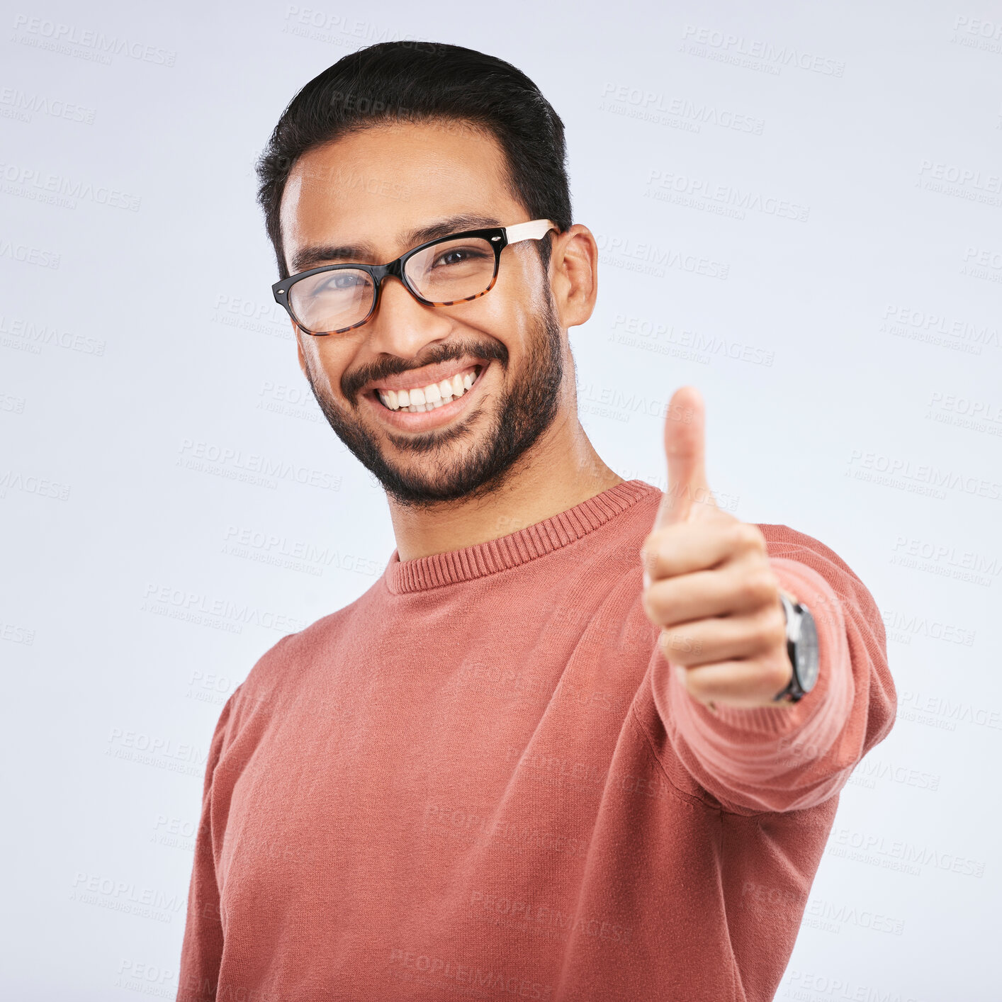 Buy stock photo Thumbs up, portrait and asian man with hands for success in studio, white background and winning news. Happy male model with glasses, ok emoji and like feedback, good review and vote yes in agreement