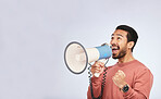 Megaphone, man and shout in studio space, white background and broadcast speech, announcement and mockup. Asian model, microphone and advertising sales, news and attention of deal, promotion or offer