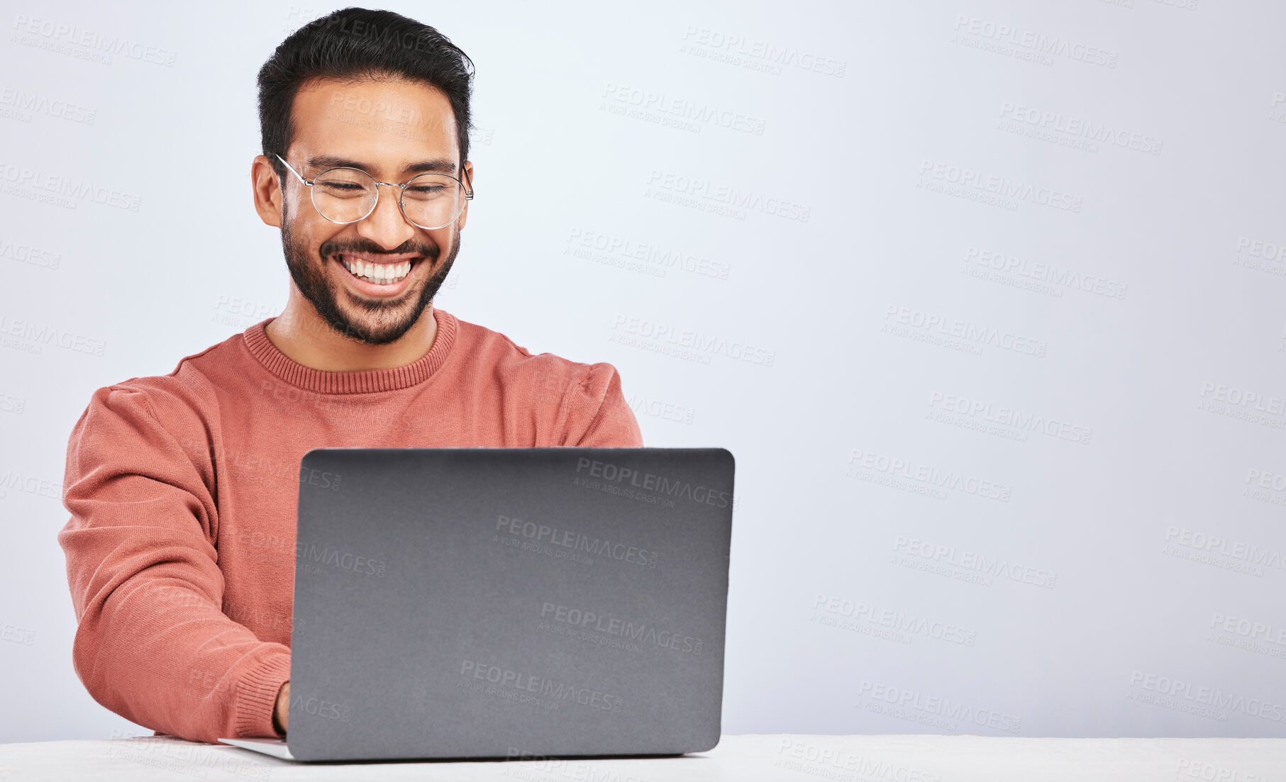 Buy stock photo Business, smile and asian man with laptop on studio for research, typing or social media on grey background. Happy, search and male freelancer online for design, blog or project, creative or planning