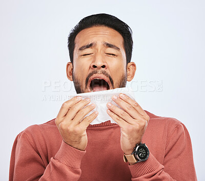 Buy stock photo Allergy, sneeze and asian man is sick with tissue in studio with grey background with cold or sinus. Virus, allergies and male person with toilet paper for flu or problem with nose or congestion.