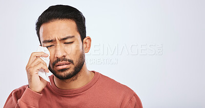 Buy stock photo Crying, depression and sad asian man in studio with tissue, crisis or broken heart on grey background. Stress, mistake and face of male with tears for anxiety, trauma or bad news, fail or mourning