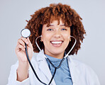 Healthcare, stethoscope and portrait of woman doctor in studio for hospital check up on grey background. Cardiology, health and face of lady cardiologist with heart, lungs and heartbeat medical tool