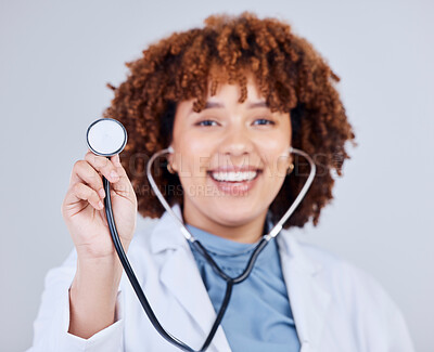 Buy stock photo Healthcare, stethoscope and portrait of woman doctor in studio for hospital check up on grey background. Cardiology, health and face of lady cardiologist with heart, lungs and heartbeat medical tool