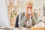 Computer, tissue and a business woman blowing nose while working at a desk, sick in the office. Cold, flu or symptoms with a young female corporate employee sneezing from hayfever allergies at work