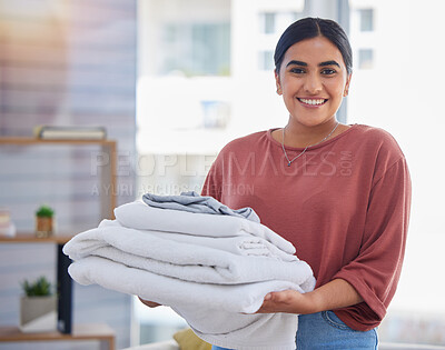 Buy stock photo Cleaning, laundry and portrait of woman in living room for housekeeping service, clothes and fabric. Hospitality, happy and cleaner with person at home for maintenance, helping and washing