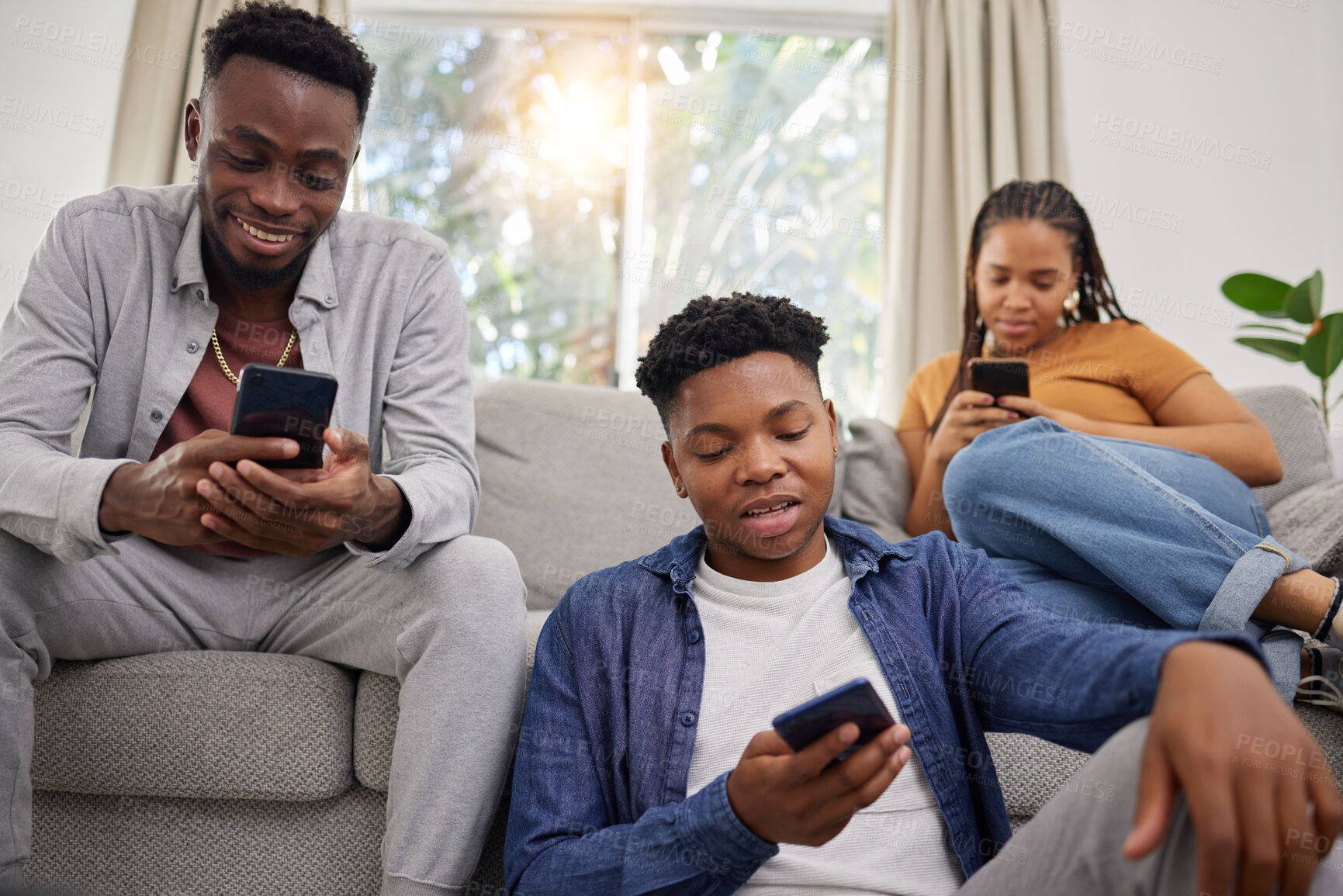 Buy stock photo Phone, communication and african friends on social media for browsing while sitting on a living room sofa. App, contact and internet with a group of black people using mobile technology in a home