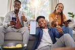 Black people, friends and phone mockup with thumbs up for approval in relax together at home. Happy African group smile and show mobile smartphone app display, like emoji or yes sign for social media
