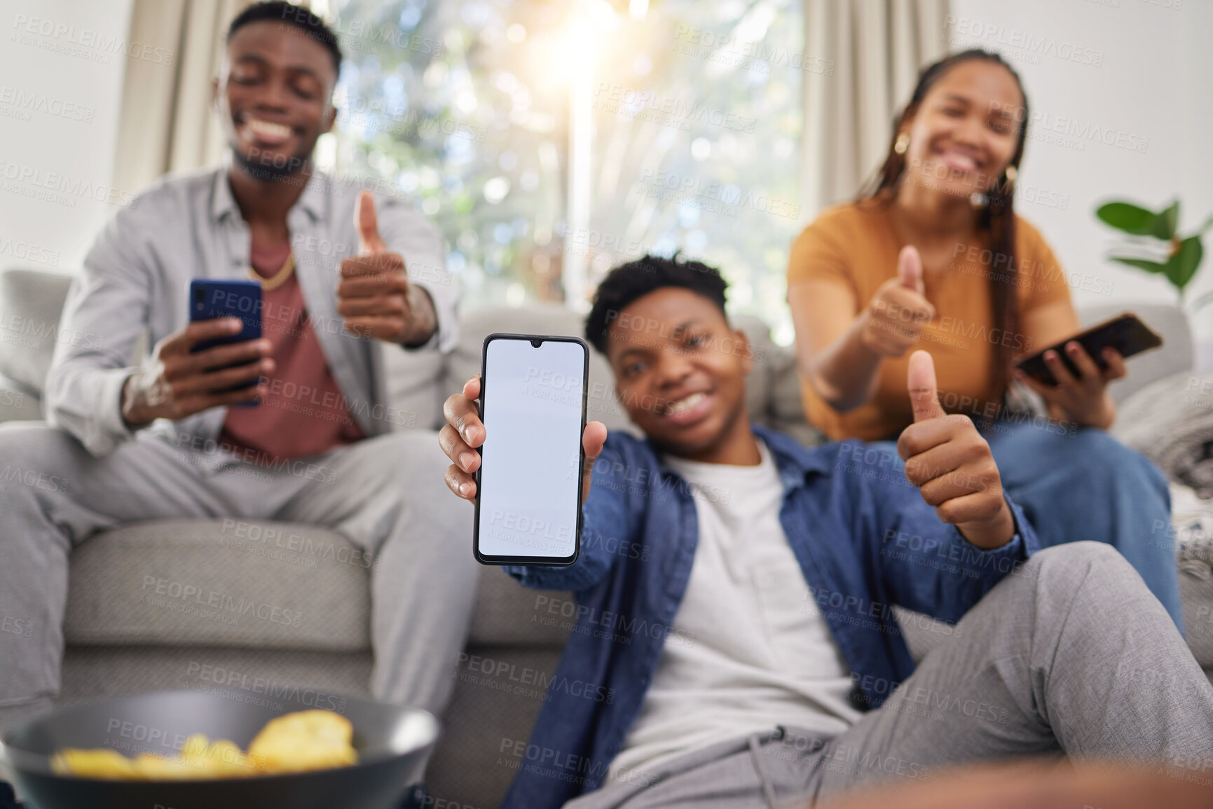Buy stock photo Black people, friends and phone mockup with thumbs up for approval in relax together at home. Happy African group smile and show mobile smartphone app display, like emoji or yes sign for social media