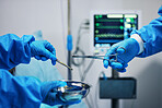 Surgery, scissors in hands and doctor with nurse, health and medical procedure, metal equipment and operating room. Healthcare, people in hospital and surgeon with treatment, tools and closeup