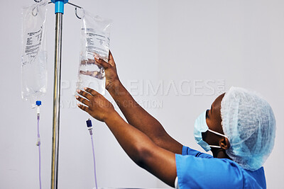 Buy stock photo Hospital, nurse with face mask and black woman with iv drip medicine, fluid infusion or liquid injection bag. Nursing, doctor or surgeon monitoring intravenous medication, 
anesthesia or healthcare