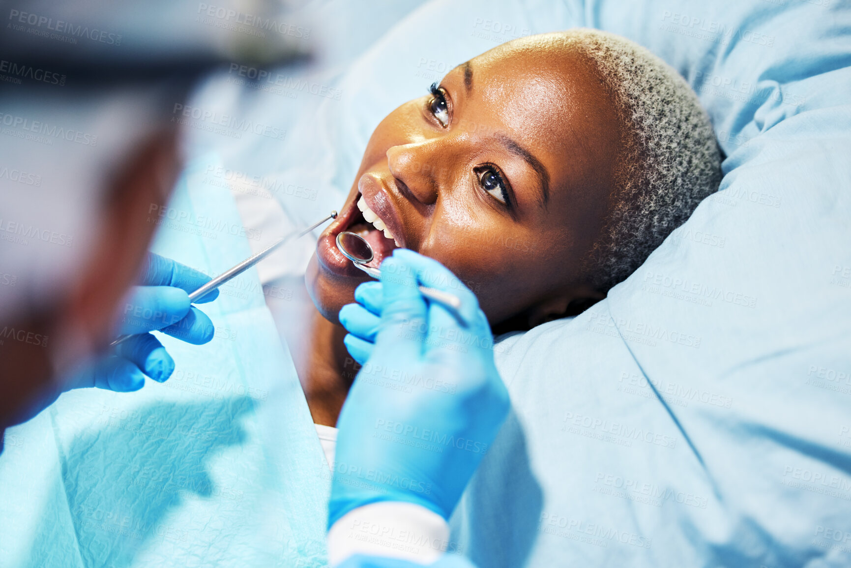 Buy stock photo Dentist, inspection and woman with tools in mouth at clinic for cavity, teeth whitening and helping hand for pain. Dental surgeon, African patient and mirror for exam, care or check for healthy smile