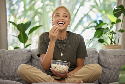 Buy stock photo Woman is laughing, popcorn and watch a movie, comedy and entertainment, streaming service and relax at home. Female person, subscription and watching funny film or series with cinema snack on sofa