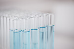 Test tube, blue chemical and closeup, chemistry and science study in lab, sample and medical research. Pharmaceutical, biotechnology and scientific experiment, glass container with liquid solution
