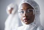 Science, serious and portrait of a black woman in a lab with a suit for security from virus. Face, hospital and an African scientist with glasses and clothes for safety from chemical and biotech