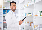Man, portrait and pharmacist with tablet in pharmacy, drugstore or shop. Face, technology and Asian medical professional, happy doctor or worker with a pharmaceutical job for healthcare in Cambodia