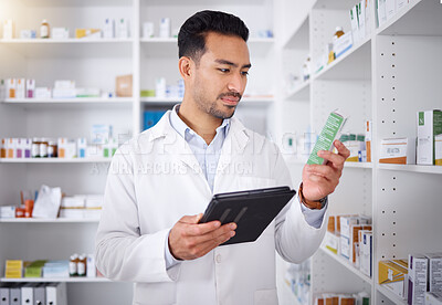 Buy stock photo Man, pharmacist and tablet for medicine, stock check and reading in pharmacy store. Technology, inventory pills and medical doctor with pharmaceutical drugs, medication or supplements for healthcare.