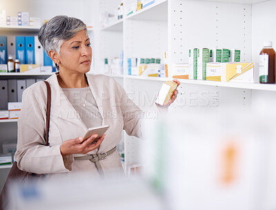 Buy stock photo Pharmacy, shelf and a woman with medicine and a phone for information or research on pills. Shopping, mature and a person in a store for medication, reading box with mobile for analysis or knowledge