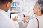 Pharmacist, typing and tablet with customer, medicine and question with discussion for product info. Man, senior patient and pills with digital touchscreen for mockup, shopping or helping in pharmacy