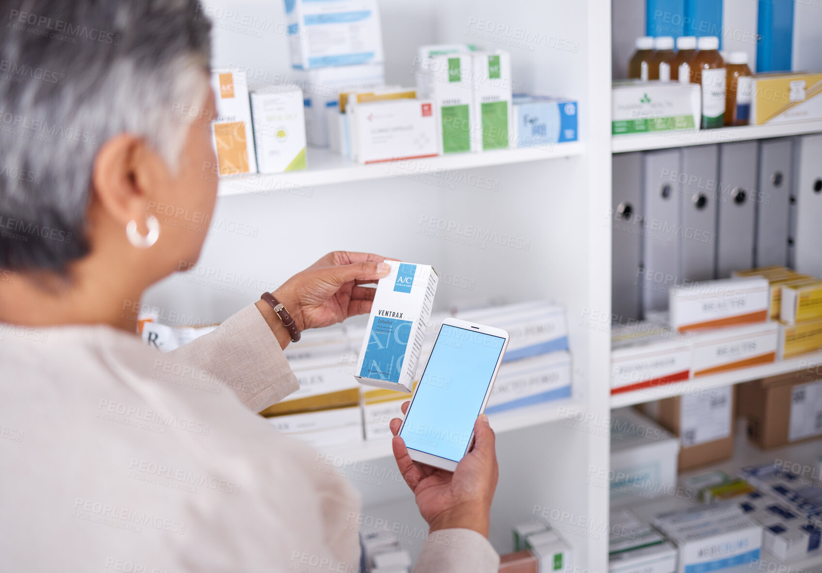 Buy stock photo Woman, hands and phone mockup at pharmacy for medication, research or information on product in store. Female person looking at medicine with smartphone display for pharmaceutical search at clinic