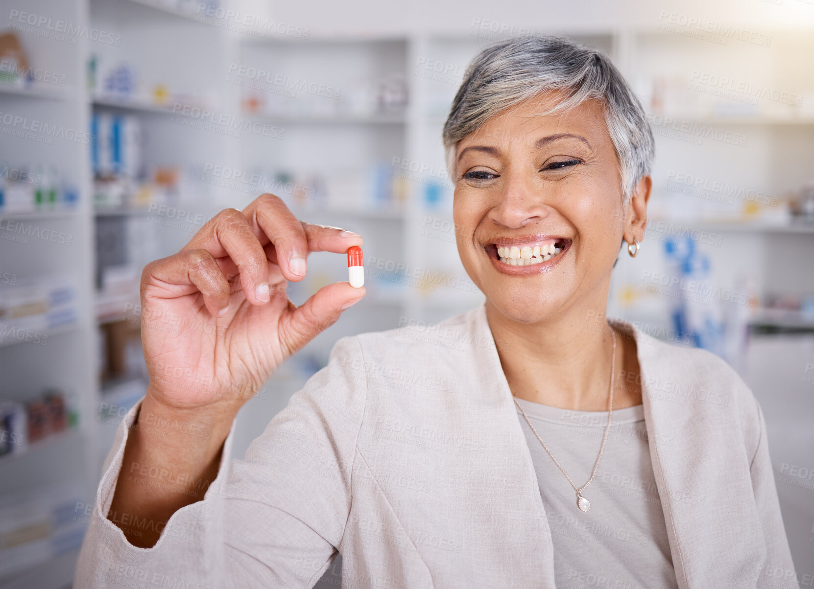 Buy stock photo Pill, medicine and woman pharmacist happy for medical treatment in a pharmacy, dispensary or drugstore for health. Senior, healthcare and professional with a antibiotics drug for research in a clinic