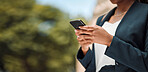 Woman, hands and phone in city for communication, social media or networking outdoors. Closeup of female person chatting, texting or typing on mobile smartphone app for online browsing in urban town