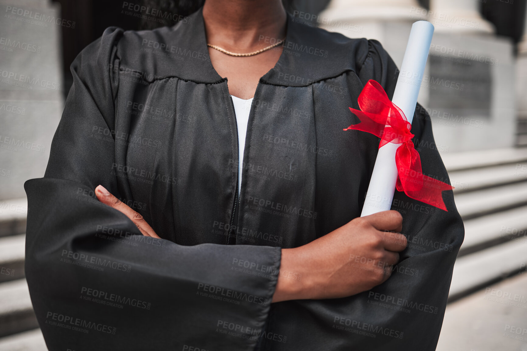 Buy stock photo Education, graduation and certificate with a student arms crossed on campus, confident in her achievement. Diploma, university or college with an african graduate standing outdoor at a ceremony