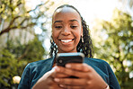 Smartphone, black woman typing outdoor with social media and chat online, communication and technology. Internet connection, text message or email with closeup, female person and mobile app in nature