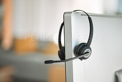 Buy stock photo Headset, computer and customer service in a call center for support, consulting or telemarketing after hours. Contact, crm and communication equipment in an empty office for help or assistance