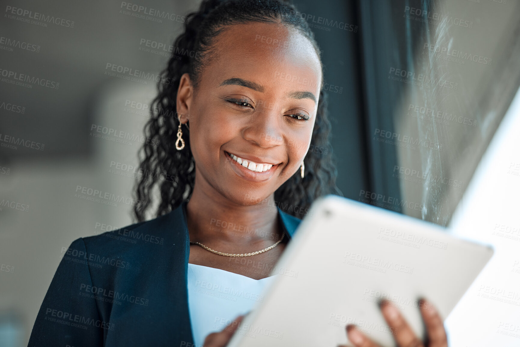 Buy stock photo Happy, lawyer and black woman with tablet in office for legal research, web app and online social media. African attorney, technology and professional reading business email, networking or internet.