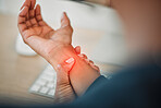 Hands, business or person with wrist pain while working on a computer in office workplace with red glow or injury. Hurt, carpal tunnel syndrome or closeup of injured trader with discomfort arm cramp