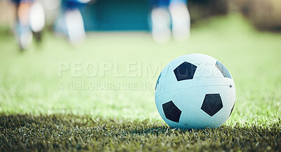 Buy stock photo Field, sports and a football on the grass for a game, goal or training in summer. Fitness, playing and gear for soccer, competition or athlete exercise on the ground for a match or cardio in nature