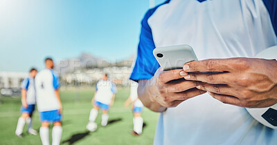 Buy stock photo Football, field, phone and man hands for competition, training or fitness news, social media chat and blog. Soccer player or person typing on mobile app for sports information, health or goal check