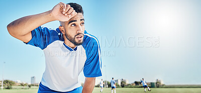 Buy stock photo Football player, tired and man sweating outdoor on a field for sports and fitness competition. Male soccer or athlete person on a break while exhausted from training workout with mockup banner space
