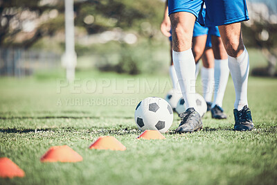 Buy stock photo Feet, soccer player and ball with training cone on a field for sports game and fitness. Legs or shoes of male soccer or athlete person outdoor for agility, performance or workout on a grass pitch