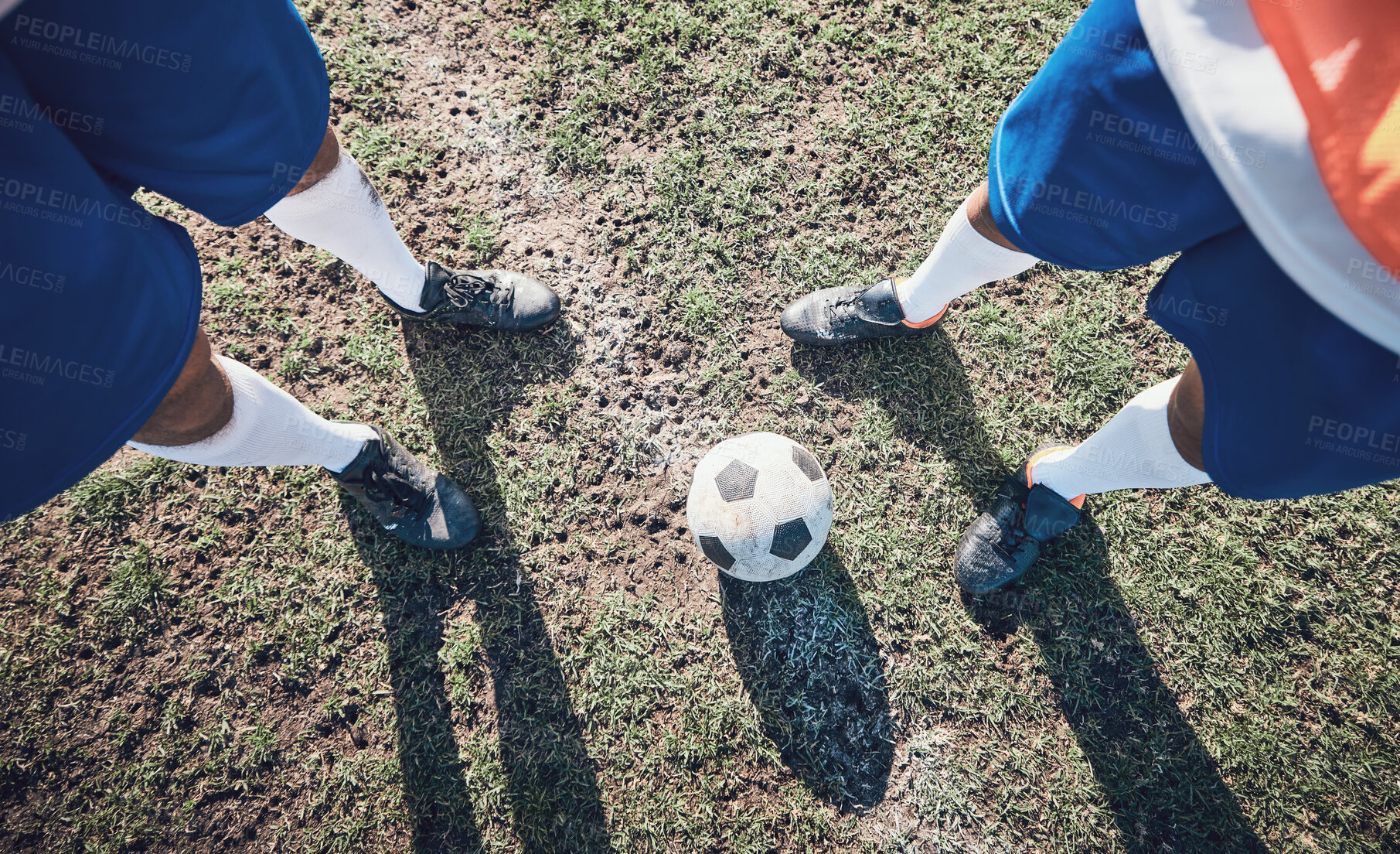 Buy stock photo Legs, soccer and ball with a team ready for kickoff on a sports field during a competitive game from above. Football, fitness and teamwork on grass with players standing on grass to start of a match