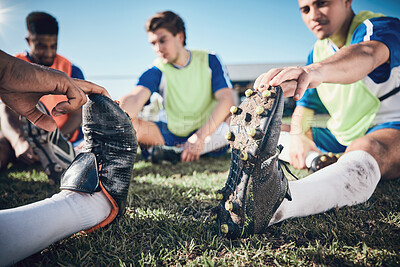 Buy stock photo Football player, stretching and feet of men training on a field for sports game and fitness. Closeup on shoes of male soccer team or athlete group for challenge, workout or exercise outdoor on pitch