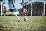 Fitness, penalty and soccer player scoring a goal at training, game or match at a tournament. Sports, exercise and back of male football athlete kicking ball at practice on outdoor field at stadium.