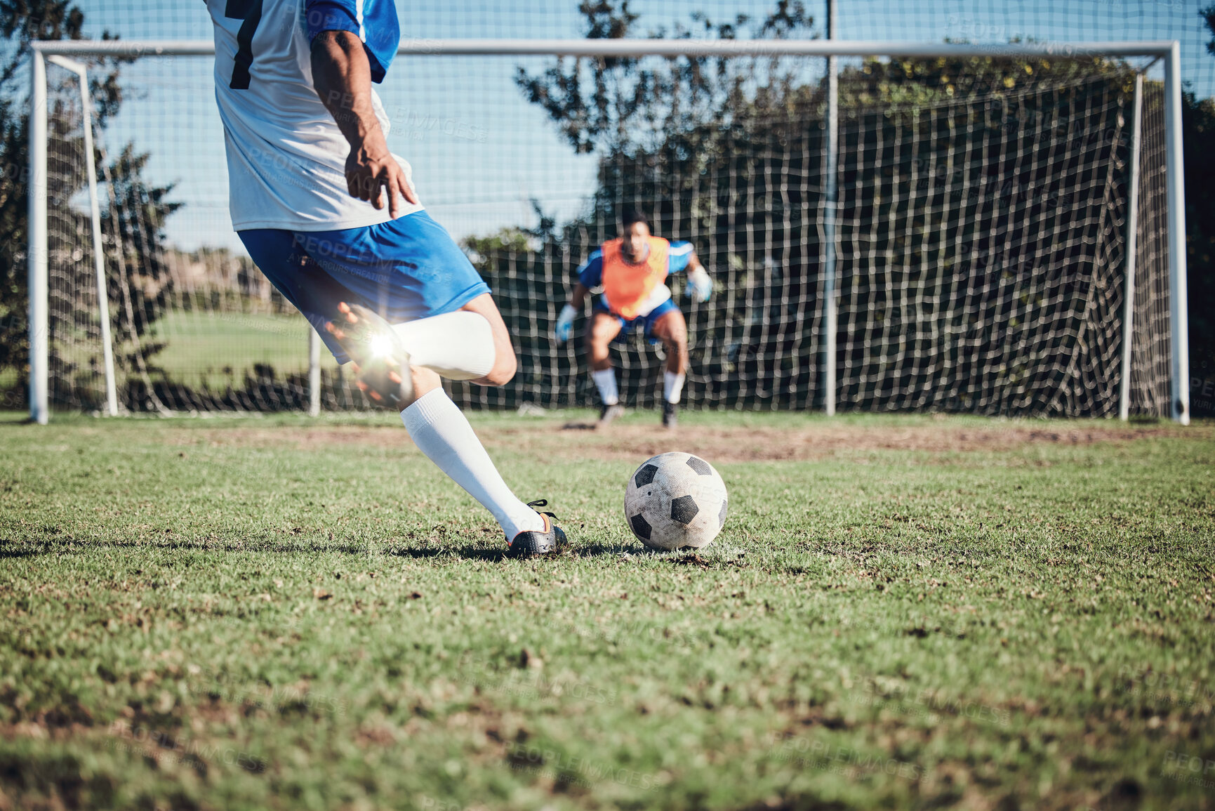 Buy stock photo Fitness, penalty and soccer player scoring a goal at training, game or match at a tournament. Sports, exercise and back of male football athlete kick ball at practice on outdoor field at stadium.