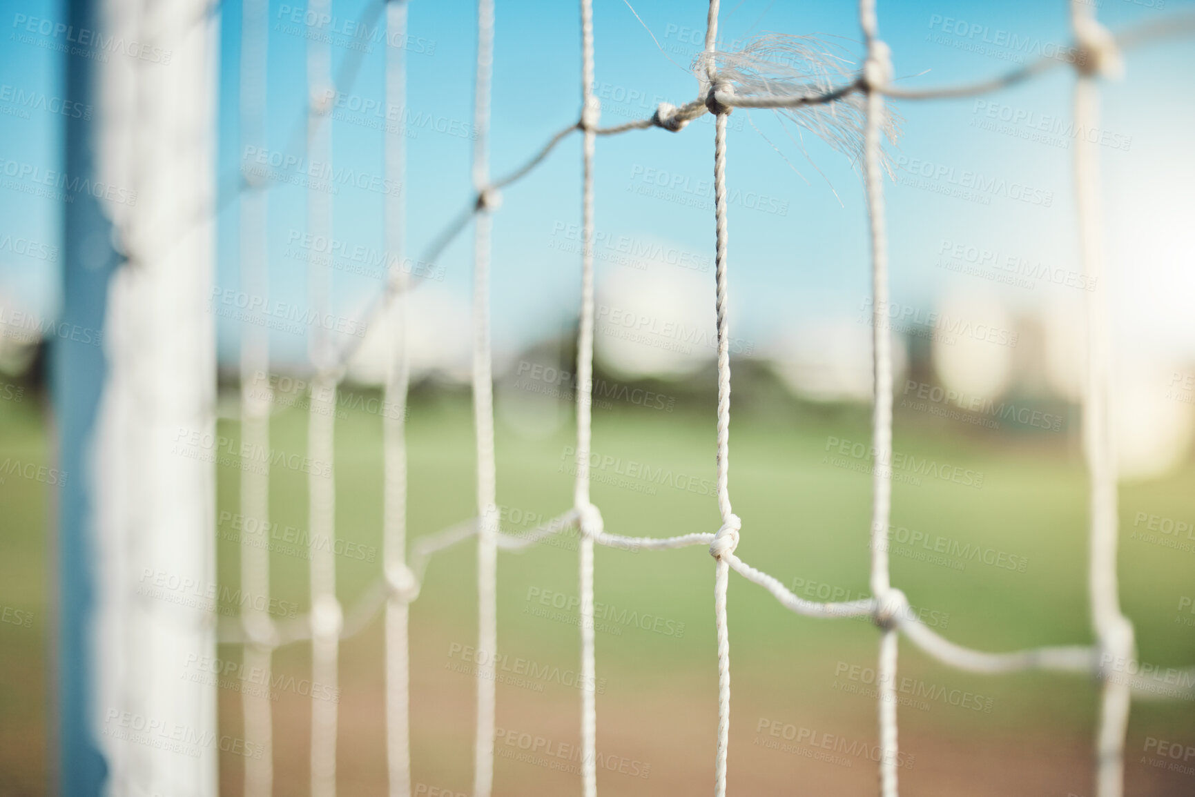 Buy stock photo Empty, sports and goal post on soccer field for fitness training, exercise or workout outdoors. Football club, grass pitch background or closeup of blur net of game in competition or match contest 