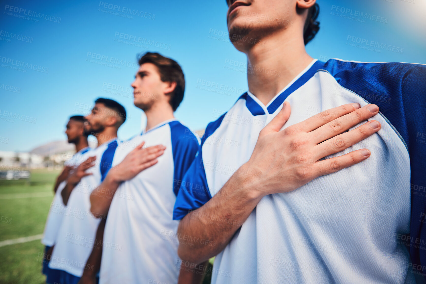 Buy stock photo Football team, national anthem and listening at stadium before competition, game or match. Soccer, song and sports players together for pride, collaboration for contest or exercise with hands closeup