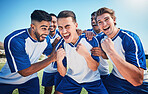 Football player, game and men celebrate together on a field for sports and fitness win. Happy male soccer team or athlete group with fist for challenge, competition or achievement outdoor on pitch