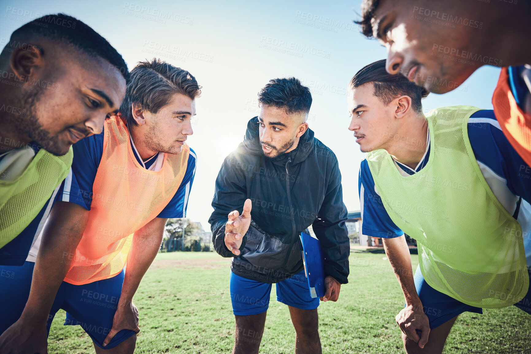 Buy stock photo Coaching, football circle and people talking for sports teamwork, competition strategy and game on field. Listening, speaking and man, soccer player team or group motivation, goals or training advice